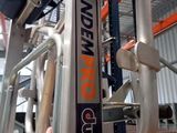 a hand that is holding onto the handlebar of a gym equipment rack
