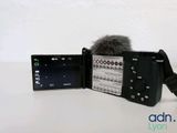 a black camera with a microphone attached to it