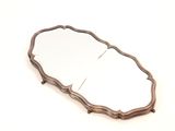 an image of a mirror on a white surface with a wooden frame