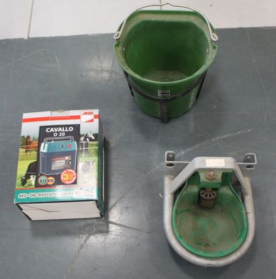 a green bucket sitting on the floor next to a green bucket