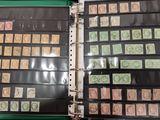 a lot of stamps on the pages of a binder