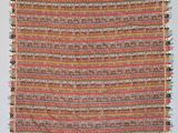 a close up of a multicolored rug with fringes on it