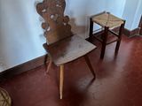 two chairs and a table in the corner of a room