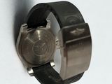a close up of a watch on a white surface