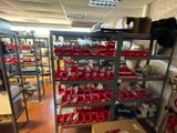 a room with a lot of shelves and bins on it
