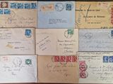 several old envelopes are sitting on a wooden table