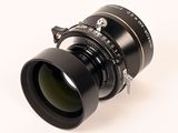 an image of a close up of a camera lens on a white surface