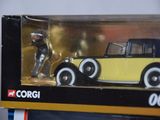 a toy car in a box with a figure in it