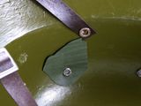a close up of a helmet with a pair of scissors attached to it