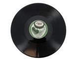 a black vinyl record with a picture of a cucumber on it