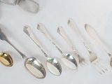 a lot of spoons that are sitting on a table