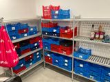 many baskets on the shelves in the store