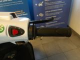 a motorcycle that is parked in front of a sign