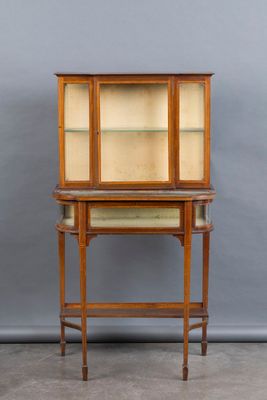 a wooden display cabinet with glass shelves and shelves on top