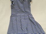 a blue and white striped dress on a white background