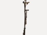 sculpture of a bird on a pole with a bird on it ' s head