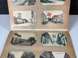 an old photo of a book opened to show pictures of a town