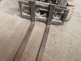 a forklift that is sitting in the middle of the floor