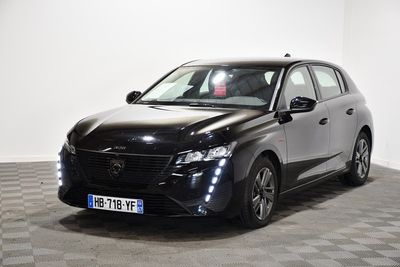 a picture of a black car parked on a checkered floor