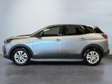 the silver car is parked in the garage of a dealers showroom