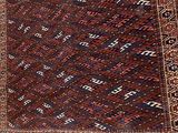 an old rug with many different colors and patterns on it