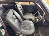 a black car with leather seats and a steering wheel