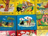 many children ' s books that are on the table
