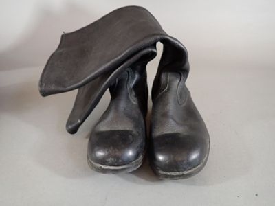 a pair of shoes with a hat on top of them
