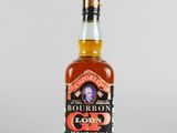 une photo d'une bouteille de bourbon posée sur une table