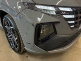 the front end of a gray honda hrx parked in a garage