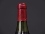 a bottle of wine that is sitting on a table
