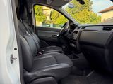 a white van with black seats in the back of it