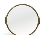 a close up of a mirror on a white surface with a white background