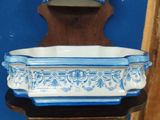 a blue and white bowl sitting on a small table