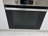 a oven that is built into the wall in the kitchen
