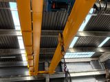 a crane that is hanging from the ceiling of a building