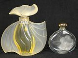 two glass vases that are sitting next to each other