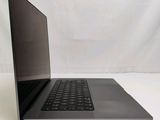 a laptop that is sitting on a white surface
