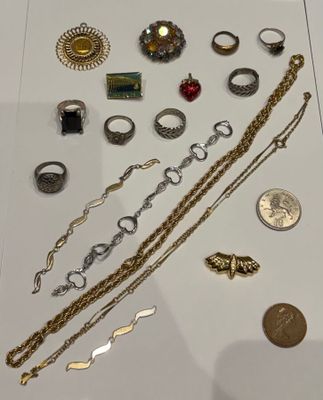 a lot of jewelry on display in a glass case