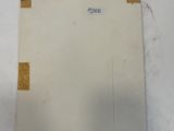 an image of a piece of paper with a sticker on it