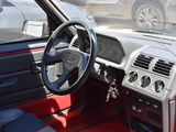 a car dashboard with a steering wheel and a dash board