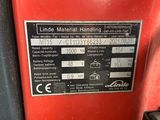 an image of a close up of a red machine with a label on it