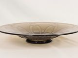 a glass bowl that is sitting on a table
