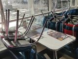 many chairs and tables in the airport terminal waiting for passengers