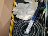 a box full of tools and a hose in it