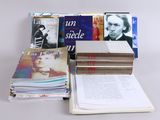 several books are stacked on top of each other on a table