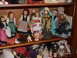 many dolls on the shelves in the room