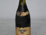 a bottle of wine that is sitting on a table