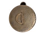 a close up of a metal disc with a letter d on it