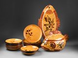 many plates and bowls that are sitting on a table